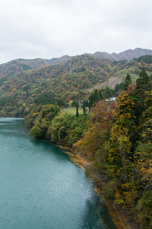 Autumn Hill with Blue Lakeの写真素材