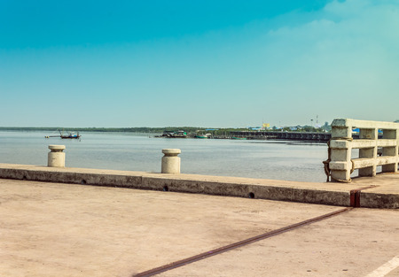 concrete mooring a boat to a pier の写真素材