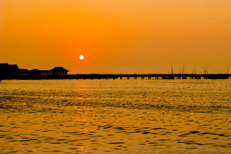 silhouette  pier and sea on sunset の写真素材