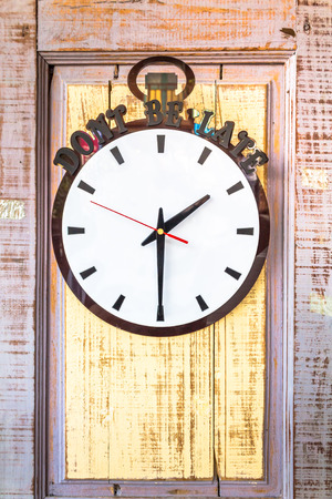 circle clock on woodframe.の写真素材
