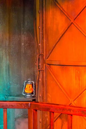 Jack o lanterns Halloween pumpkin face on davil door background.の写真素材