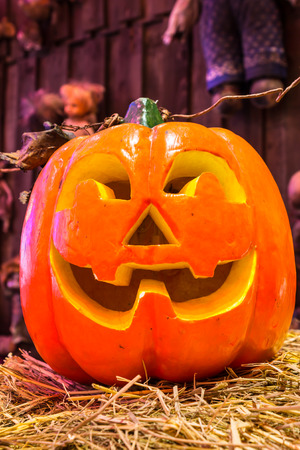 Jack o lanterns Halloween pumpkin face on scary dools background.の写真素材