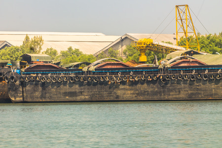 empty cassava barges floating in river.の写真素材