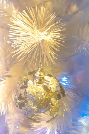 Close-up of Christmas ornaments on White Christmas tree Background.の写真素材