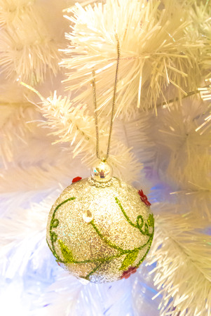 Close-up of Christmas ornaments on White Christmas tree Background.の写真素材