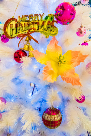 Close-up of Christmas ornaments on White Christmas tree Background.の写真素材