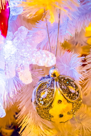 Close-up of Christmas ornaments on White Christmas tree Background.の写真素材