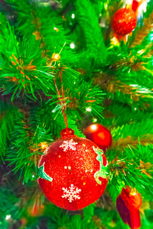 Close-up of Christmas ornaments on Christmas tree Background.の写真素材
