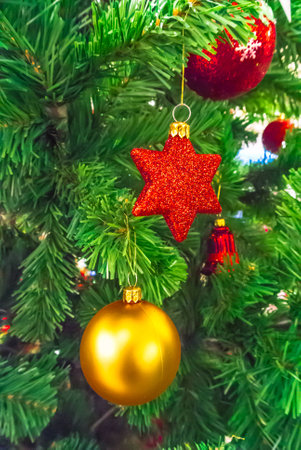 Close-up of Christmas ornaments on a Christmas tree.の写真素材