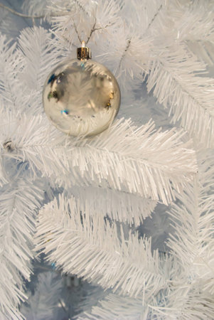 Close-up of Christmas ornaments on White Christmas tree Background.の写真素材