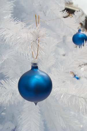 Close-up of Christmas ornaments on White Christmas tree Background.の写真素材