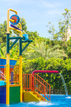 Colorful waterpark tubes and pool in tropical aquapark.のeditorial素材