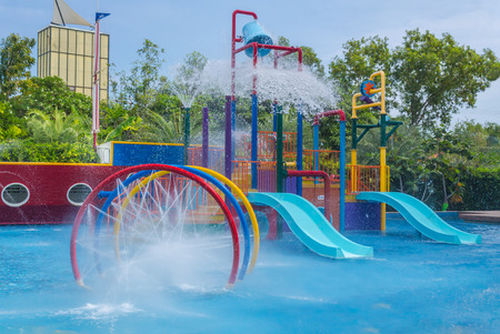 Colorful waterpark tubes and pool in tropical aquapark.のeditorial素材