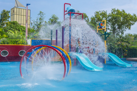 Colorful waterpark tubes and pool in tropical aquapark.のeditorial素材