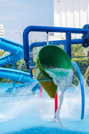 Colorful waterpark tubes and pool in tropical aquapark.のeditorial素材