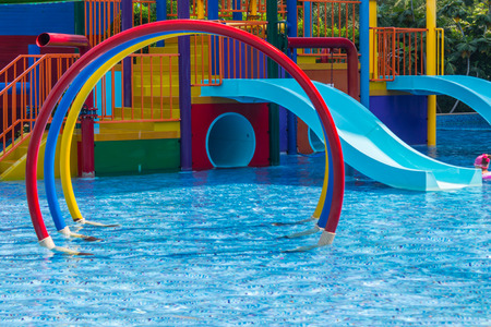 Colorful waterpark tubes and pool in tropical aquapark.のeditorial素材