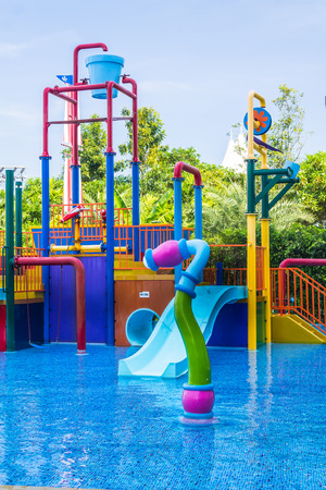 Colorful waterpark tubes and pool in tropical aquapark.のeditorial素材