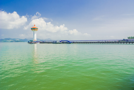Walkway to lighthouse on bluesky background.の写真素材