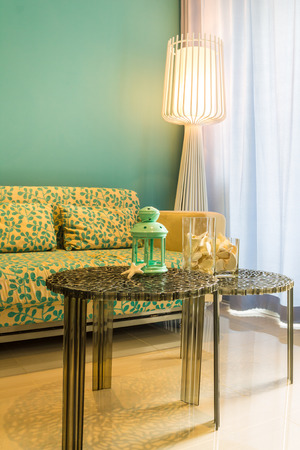Interior of stylish sofabed with cushions in a modern livingroom.の写真素材