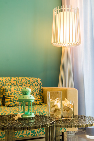 Interior of stylish sofabed with cushions in a modern livingroom.の写真素材
