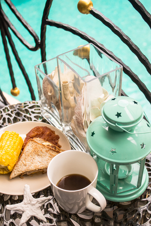 Sandwich, Fried chicken and Corn boil, Breakfast set on relaxing terrace.の写真素材