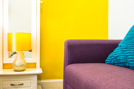 Interior Design, Beauty Living space: Sofabed, White Wooden bedside table and reading lamp, Living space in Bedroom.の写真素材