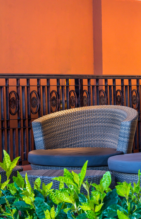 Multi color round wicker Table sets in garden.の写真素材