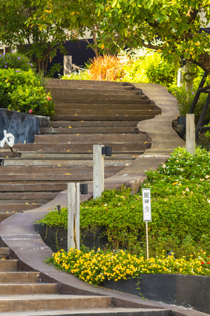 Curve stairway to flower garden in sunny day.の写真素材