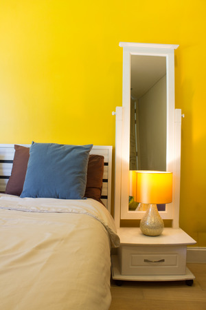 Interior Design: Modern Bedroom, White Wooden bedside table and reading lamp.の写真素材