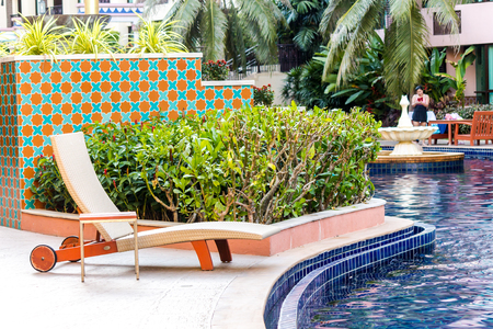 Relaxing Tanning bed beside swimming pool.の写真素材