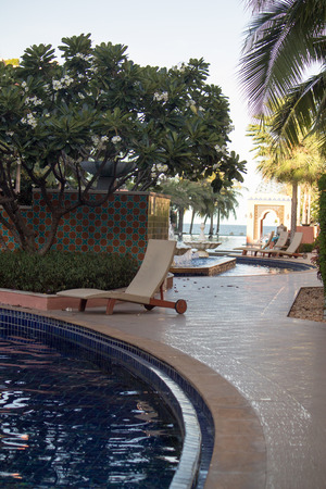 Relaxing Tanning bed beside swimming pool.の写真素材