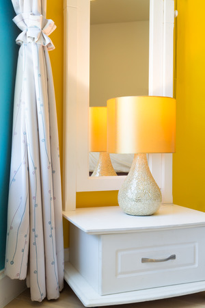Interior Design: Modern Bedroom, White Wooden bedside table and reading lamp.の写真素材