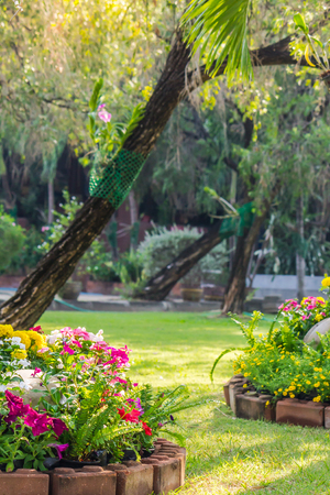 Landscaped flower garden with lots of colorful blooms.の写真素材