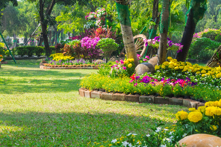 Landscaped flower garden with lots of colorful blooms.の写真素材