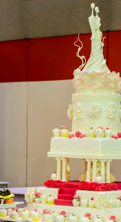 Sweet beauty flower and topping pastel color on wedding cake decoration.の写真素材