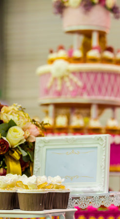 Sweet beauty flower and topping pastel color on wedding cake decoration.の写真素材