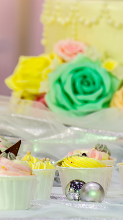 Sweet beauty rose flower and topping pastel color on wedding cake decoration.の写真素材