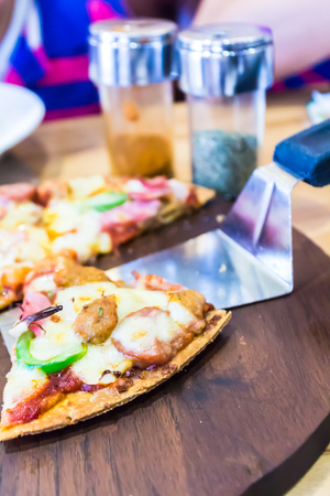 Delicious homemade slice pizza on the table.の写真素材