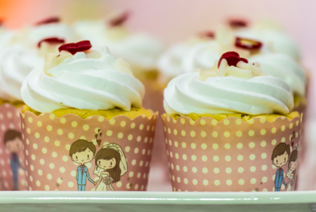 Cupcakes on tier at wedding reception.の写真素材