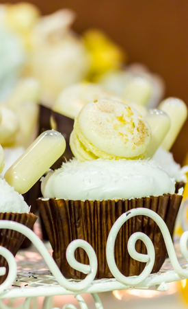 Cupcakes on tier at wedding reception.の写真素材