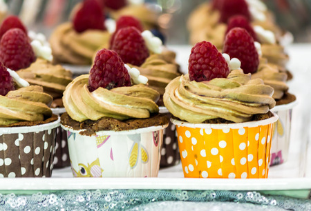 Cupcakes on tier at wedding reception.の写真素材