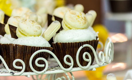 Cupcakes on tier at wedding reception.の写真素材