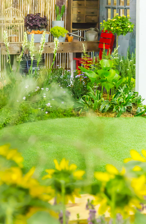 Beautiful cobblestone pathway curving through garden.の写真素材