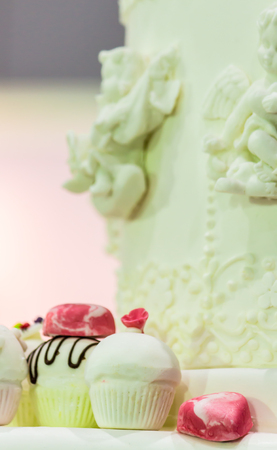 Cupcakes on tier at wedding reception.の写真素材