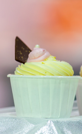 Cupcakes on tier at wedding reception.の写真素材