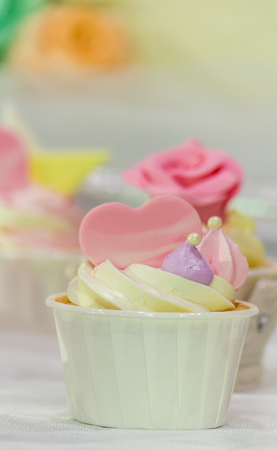 Cupcakes on tier at wedding reception.の写真素材