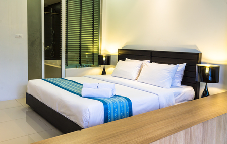 Pool access cozy modern bedroom decoration with soft seats and cushions.の写真素材