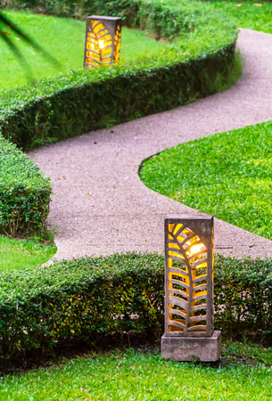 Carved stone lamp decoration in cozy home garden on summer.の写真素材