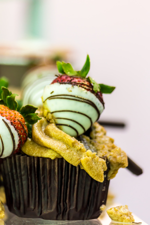 Cupcakes on tier at wedding reception.の写真素材