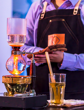 Syphon Coffee or Vacuum Coffee is full immersion tasteful, Blended smell and taste of roasted coffee with direct contact boiled water and show boiling water, stunning vacuum process by Beam heater.の写真素材